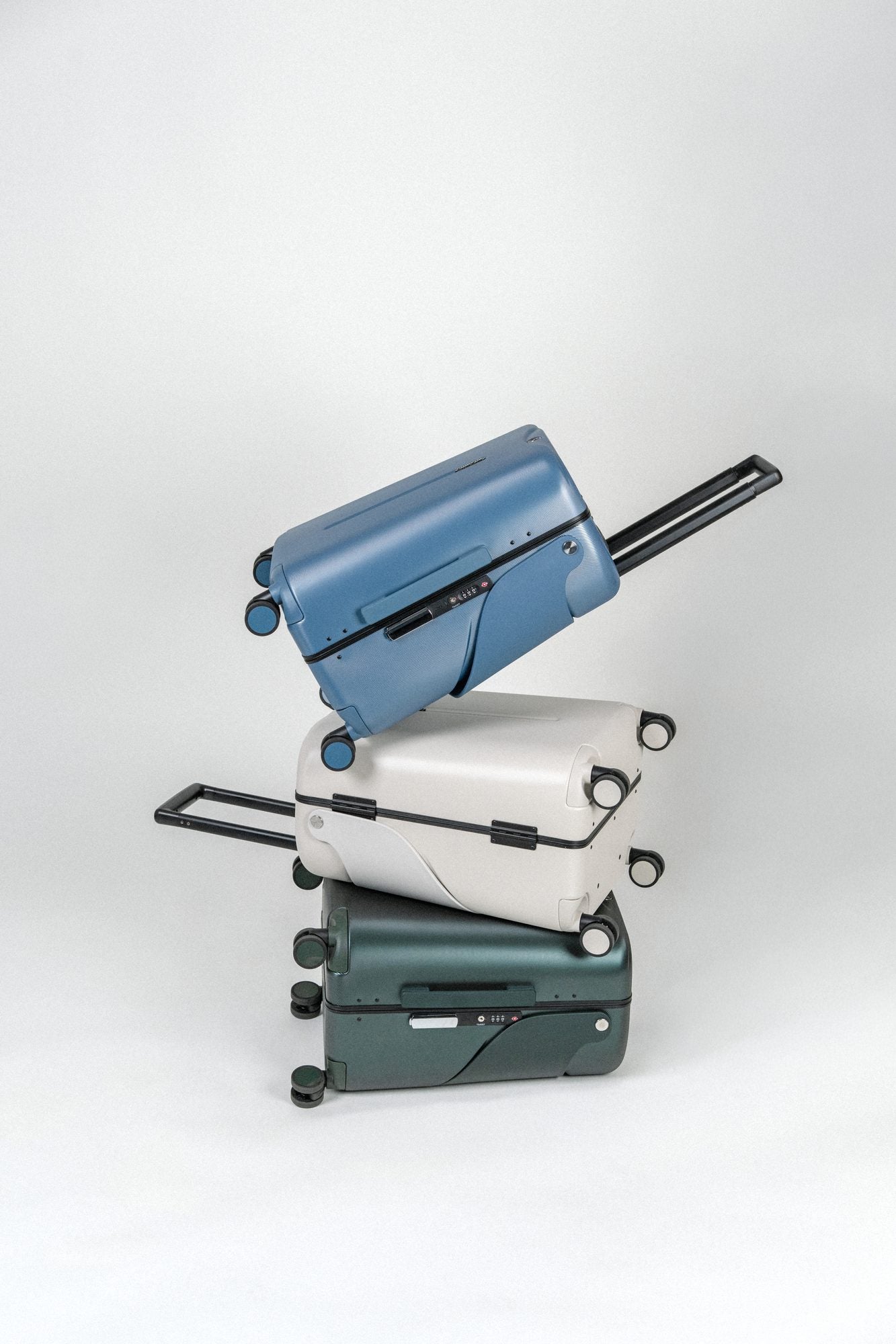 Three MiaMily suitcases stacked