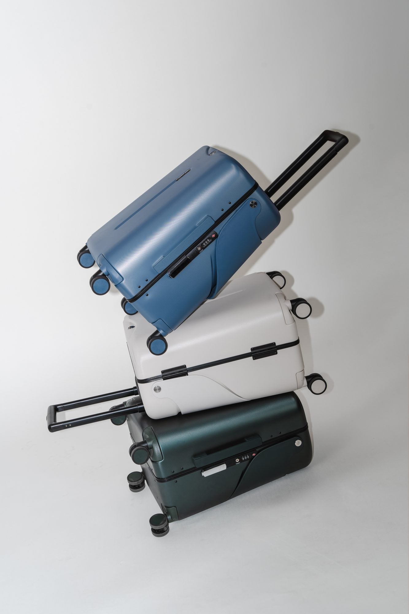 Three MiaMily suitcases stacked at an angle