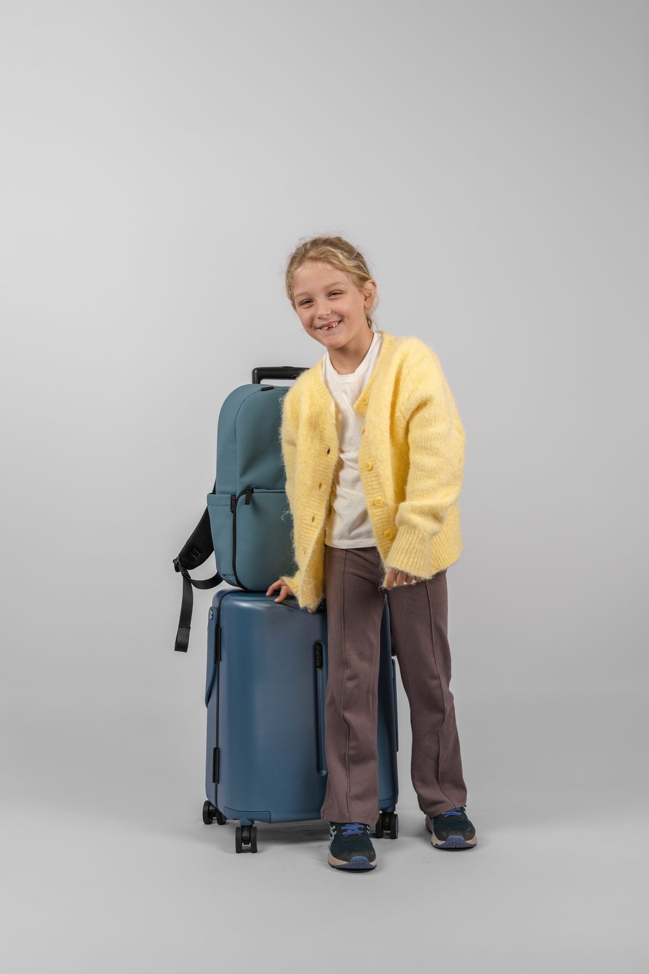 A child beside a stacked Slate Blue set