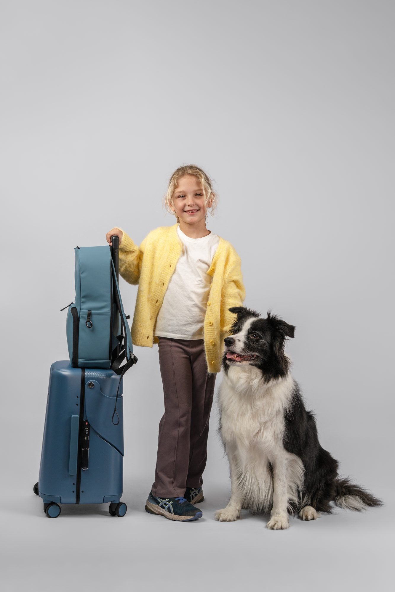 A child, a stacked MiaMily set, and the family dog