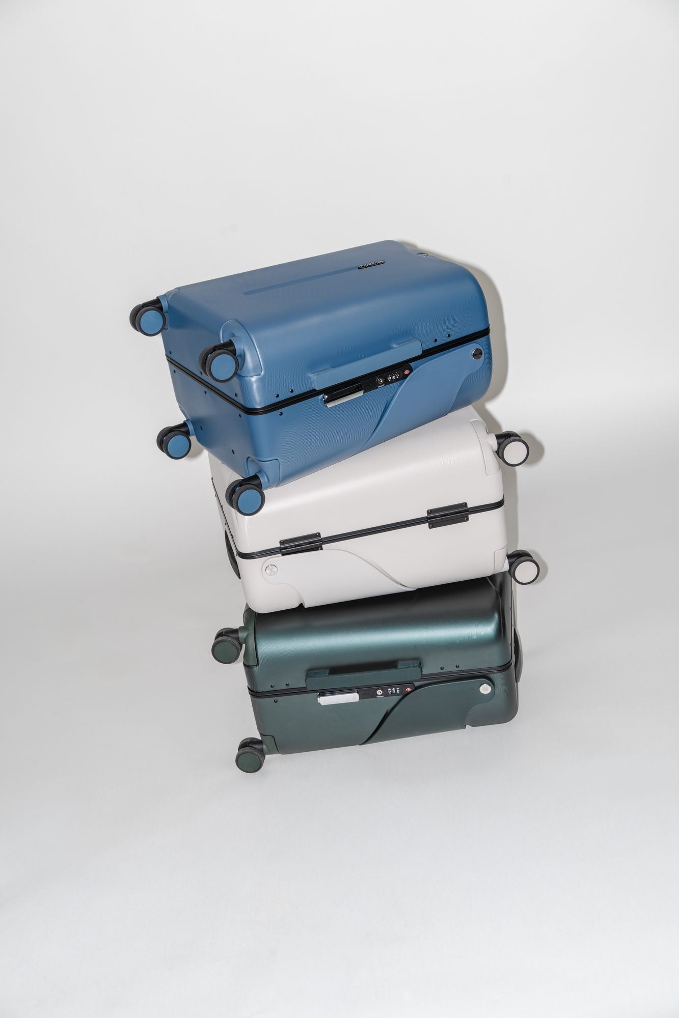 Stacked MiaMily suitcases